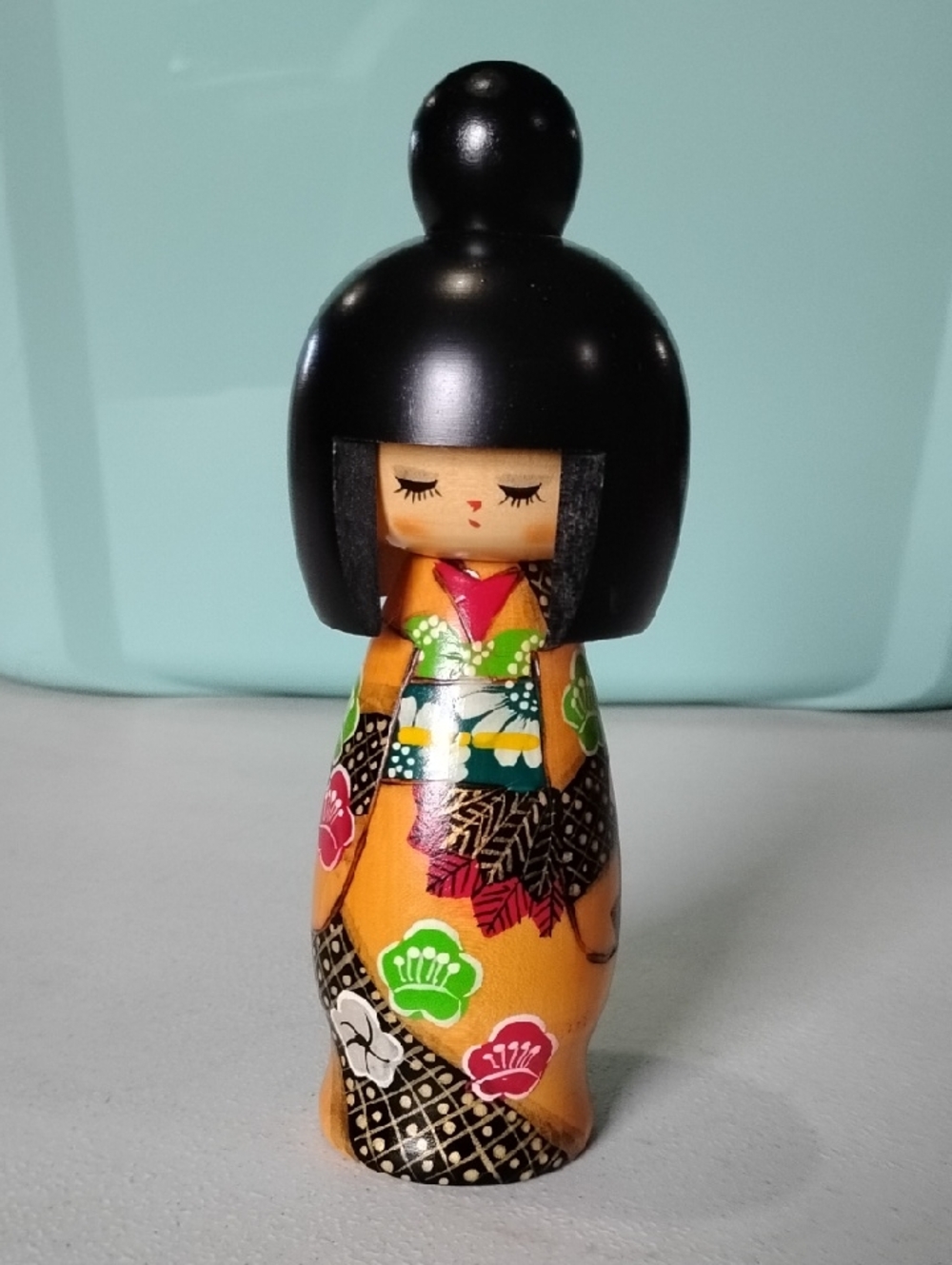 Hand-Painted Wooden Orange Kokeshi Doll with Black Hair - Classic Japanese Style
